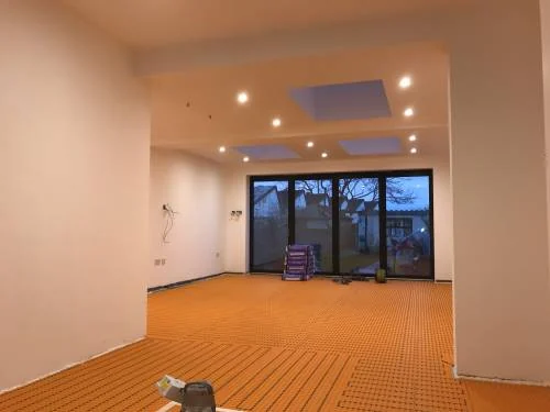 Large extension interior during underfloor heating installation
